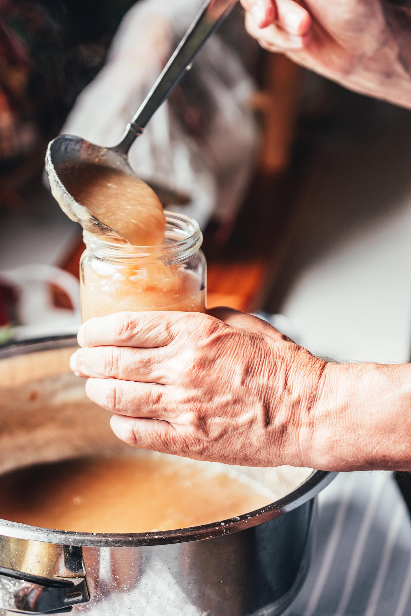 Chef's hands preparing sauce